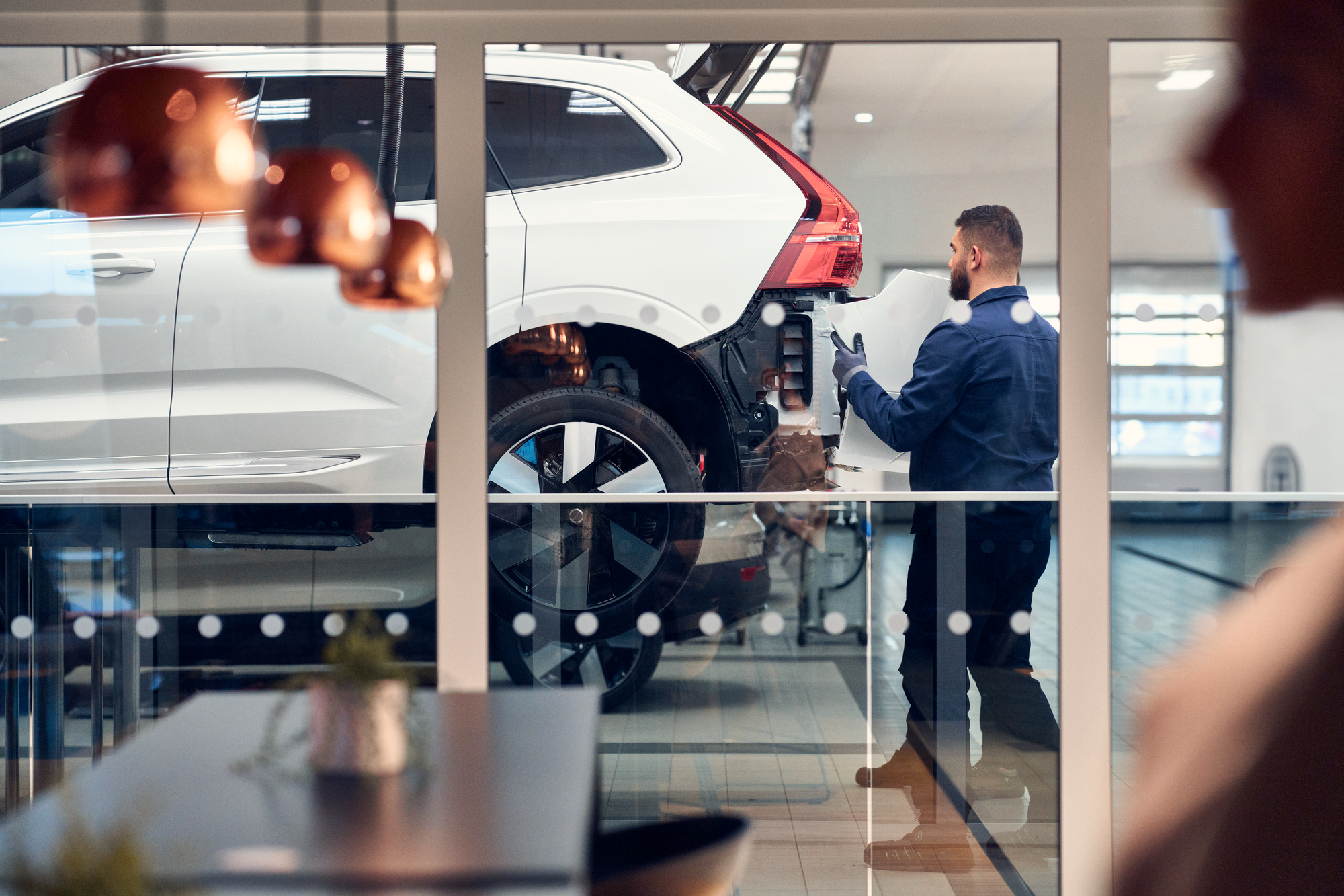Volvo mechanic working on a car
